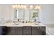 A spacious bathroom featuring a dual sink vanity, modern fixtures, and a sleek design at 441 Spoonbill Ct, Kenansville, FL 34739