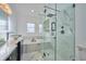 Bright bathroom featuring a glass shower enclosure, a soaking tub and a modern vanity at 441 Spoonbill Ct, Kenansville, FL 34739