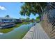 Dock with a view of the canal at 441 Spoonbill Ct, Kenansville, FL 34739