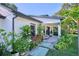 Front entrance of home with rock garden and pathway at 441 Spoonbill Ct, Kenansville, FL 34739