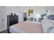 View of the main bedroom with neutral tones and a glimpse into the ensuite bath and access to other rooms at 441 Spoonbill Ct, Kenansville, FL 34739