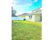 Fenced backyard with lush lawn, ideal for outdoor activities and relaxation at 4612 Terry Town Dr, Kissimmee, FL 34746