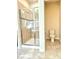 Bathroom featuring a tile shower with glass door and a separate toilet area at 4612 Terry Town Dr, Kissimmee, FL 34746