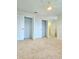 Bedroom with spacious closets and neutral carpeting at 4612 Terry Town Dr, Kissimmee, FL 34746