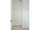 Clean, carpeted walk-in closet with white wire shelving units at 4612 Terry Town Dr, Kissimmee, FL 34746