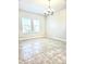 Bright dining room with tile floors and a decorative light fixture at 4612 Terry Town Dr, Kissimmee, FL 34746