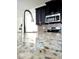 Close-up of kitchen featuring granite countertop and modern stainless steel faucet, oven and microwave at 4612 Terry Town Dr, Kissimmee, FL 34746