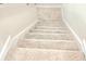 Carpeted stairway leading upstairs; provides safe and attractive access to the next level at 4612 Terry Town Dr, Kissimmee, FL 34746