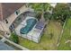 Aerial view showcases the large pool, screen enclosure, and spacious backyard at 4941 Casa Vista Dr, Orlando, FL 32837