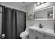 Modern bathroom featuring a sleek vanity, mirrored medicine cabinet, and shower at 4941 Casa Vista Dr, Orlando, FL 32837