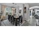 Elegant dining room featuring a stylish chandelier and seating for eight at 4941 Casa Vista Dr, Orlando, FL 32837