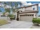 Attractive home featuring a garage and an inviting, well-maintained front lawn at 4941 Casa Vista Dr, Orlando, FL 32837