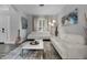 Sleek living room with a modern rug, white couches, and a decorative painting at 4941 Casa Vista Dr, Orlando, FL 32837