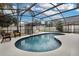 Inviting screened-in pool with poolside seating area, perfect for outdoor relaxation at 4941 Casa Vista Dr, Orlando, FL 32837