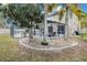 Backyard view of screened in pool, patio and beautiful landscaping at 4941 Casa Vista Dr, Orlando, FL 32837