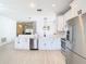 A well-lit kitchen featuring stainless steel appliances and plenty of counter space for meal preparation at 4981 Waterside Pointe Cir, Orlando, FL 32829