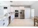 Bright kitchen featuring stainless steel appliances, white cabinets, and modern countertops at 4981 Waterside Pointe Cir, Orlando, FL 32829