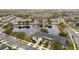 An aerial view of lakeside townhomes, boasting a serene water view and manicured landscaping at 5409 Caramella Dr, Orlando, FL 32829