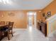 Open concept dining area with tile floors and stairs leading up to the bedrooms at 5409 Caramella Dr, Orlando, FL 32829