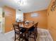 The dining area offers a kitchen view and comfortably seats six at 5409 Caramella Dr, Orlando, FL 32829