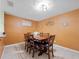 Formal dining room boasts seating for six and decorative wall art at 5409 Caramella Dr, Orlando, FL 32829