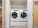 Convenient laundry room with full size washer and dryer in a closet at 5409 Caramella Dr, Orlando, FL 32829