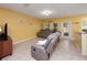 Cozy living room with tile floors, neutral-colored walls, and comfortable sofas at 5409 Caramella Dr, Orlando, FL 32829