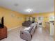 Inviting living room features tile floors, neutral-colored walls, and comfortable seating at 5409 Caramella Dr, Orlando, FL 32829