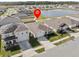 Aerial view showcasing property, neighboring homes, pond, landscaping, and fences at 5654 Winona Dr, St Cloud, FL 34771