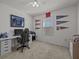 Bedroom featuring carpeted floors, a ceiling fan, and an area for studying and gaming at 5654 Winona Dr, St Cloud, FL 34771