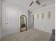 Bedroom featuring a ceiling fan and decorative wall art at 5654 Winona Dr, St Cloud, FL 34771