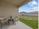 Relaxing patio area with chairs and table overlooking a large, grassy backyard at 5654 Winona Dr, St Cloud, FL 34771