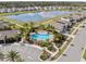 Aerial shot features community pool, lake, and surrounding homes; Florida lifestyle at 5654 Winona Dr, St Cloud, FL 34771