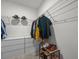 Well-organized walk-in closet with clothing racks, shelves, and ample storage space at 5654 Winona Dr, St Cloud, FL 34771