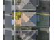 Aerial view of a home with a brown roof and an attached two car garage in a residential neighborhood at 613 Bloom Ter, Davenport, FL 33837