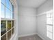 Walk-in closet with a large window, and wire shelving at 613 Bloom Ter, Davenport, FL 33837