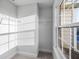 Walk-in closet with wire shelving and a window providing natural light and outdoor views at 613 Bloom Ter, Davenport, FL 33837