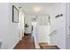 Hallway with hardwood floors leading to a bright entryway at 6443 Axeitos Ter # 105, Orlando, FL 32835