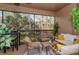 Inviting screened patio featuring comfortable seating and scenic outdoor views at 6443 Axeitos Ter # 105, Orlando, FL 32835