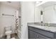 Well-lit bathroom with granite countertop and tub at 739 Annabell Ridge Rd, Minneola, FL 34715