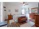 Cozy bedroom with hardwood floors, natural light, and neutral decor at 739 Annabell Ridge Rd, Minneola, FL 34715