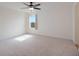 Bright bedroom with ceiling fan and window, providing an empty space ready for personalization at 739 Annabell Ridge Rd, Minneola, FL 34715