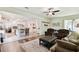 Open concept living room with view into the kitchen area at 739 Annabell Ridge Rd, Minneola, FL 34715