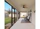 Relaxing screened patio with a ceiling fan and view of the backyard, perfect for enjoying the outdoors at 739 Annabell Ridge Rd, Minneola, FL 34715