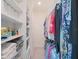 Spacious walk-in closet with custom shelving provides ample storage for clothes and accessories at 739 Annabell Ridge Rd, Minneola, FL 34715