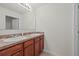 Bathroom with a double sink vanity, large mirror, and tiled floors at 817 Sheen Cir, Haines City, FL 33844