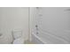 Clean bathroom with a white bathtub and shower combination at 817 Sheen Cir, Haines City, FL 33844