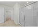 Bathroom featuring a glass-enclosed shower and tiled floors at 817 Sheen Cir, Haines City, FL 33844