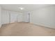 A view of the bedroom showcasing plush carpet and white doors leading to other rooms at 817 Sheen Cir, Haines City, FL 33844