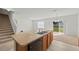 Bright kitchen featuring a double sink, wooden cabinetry, and a view of the backyard at 817 Sheen Cir, Haines City, FL 33844